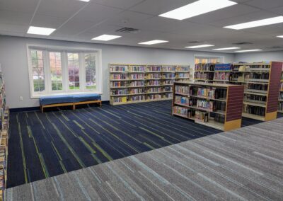 New children's area with all books on the shelves but little other furniture