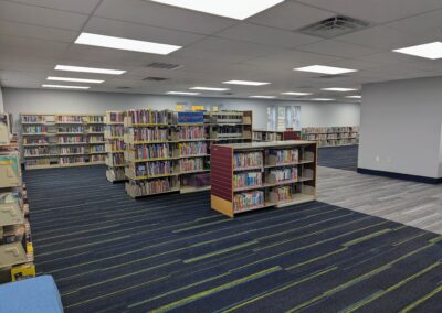 New children's area with all books on the shelves but little other furniture