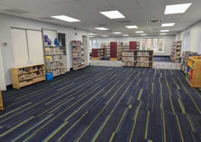 New children's area with all books on the shelves but little other furniture